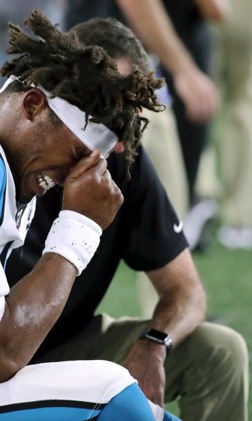 Panthers' Cam Newton remains in walking boot, gets treatment